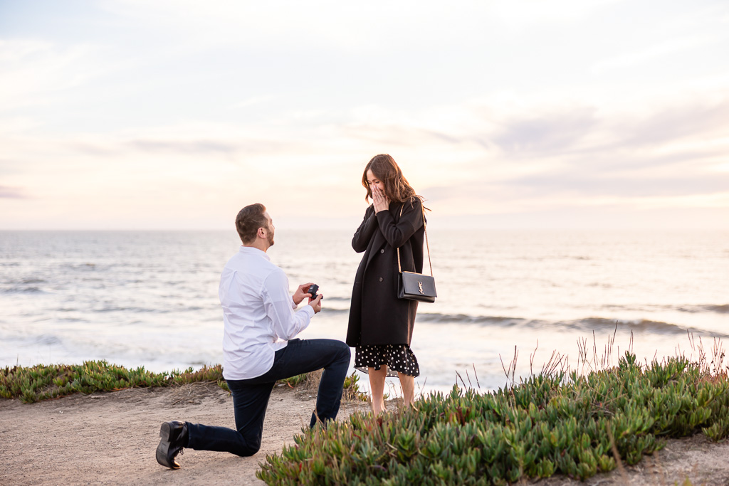 sunset surprise proposal on a cliffside in Half Moon Bay