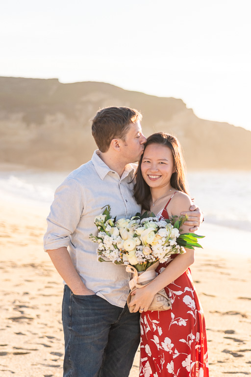 engagement photos with bouquet and red dress