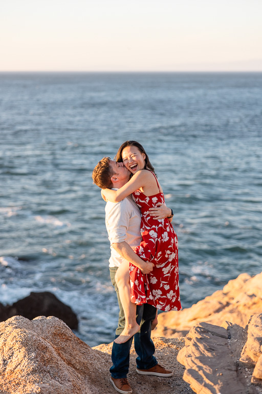 fun candid engagement photos by the ocean