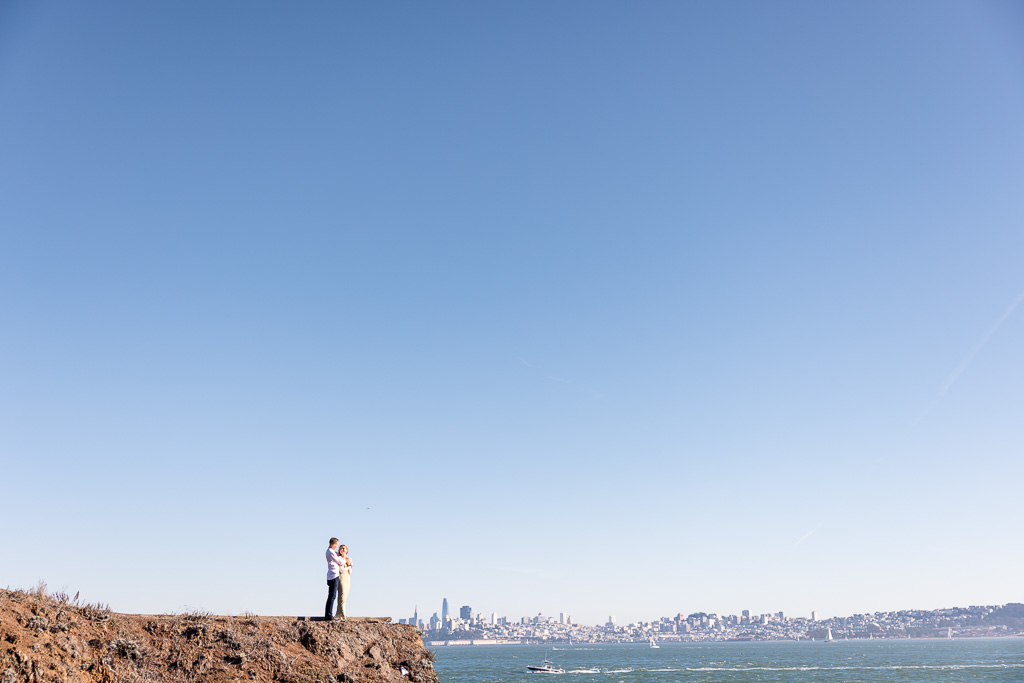 far away engagement photo with San Francisco skyline in the background