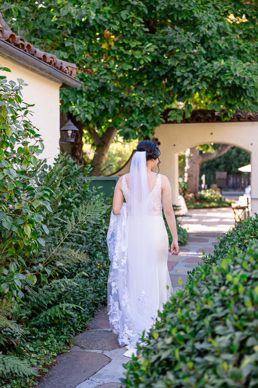 bride walking in a garden