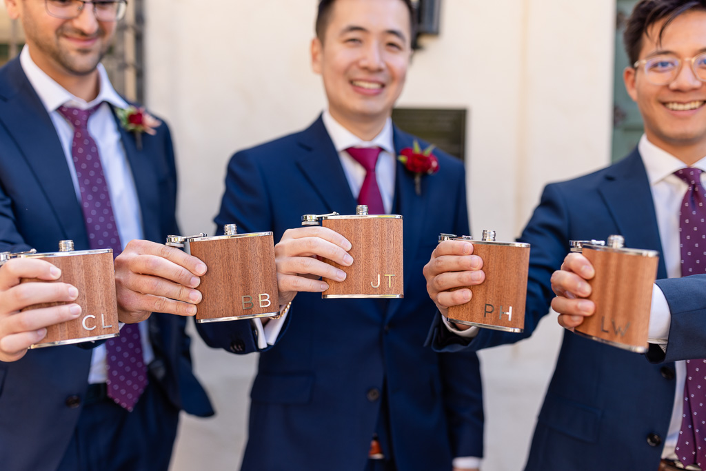 groom and groomsmen with monogrammed flasks