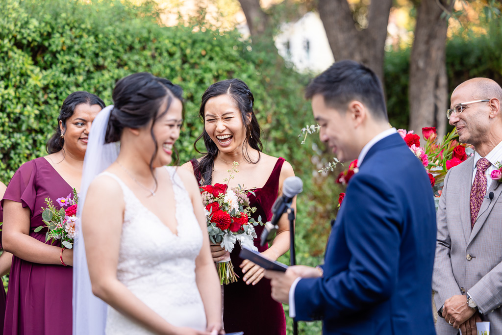 bridesmaid laughing at wedding vows