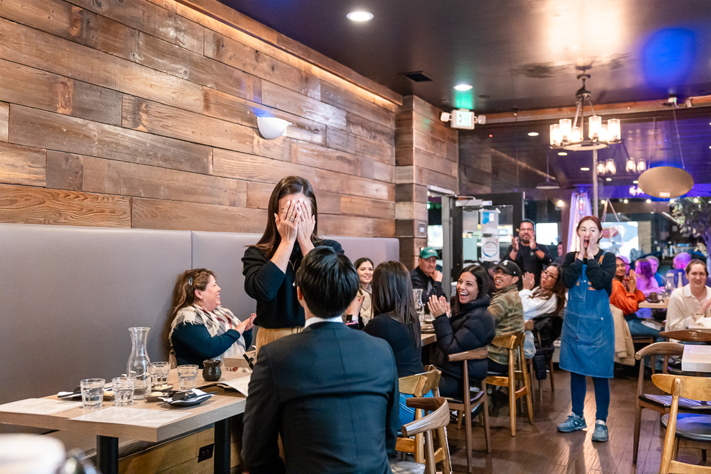 sushi restaurant surprise proposal with onlookers