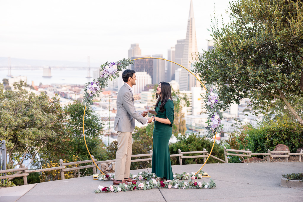 circular arch decor for surprise proposal with San Francisco downtown view