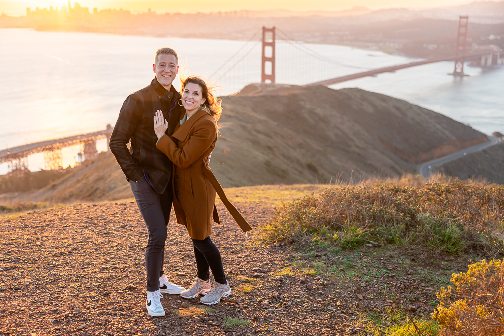 photo of couple just engaged over the Golden Gate Bridge