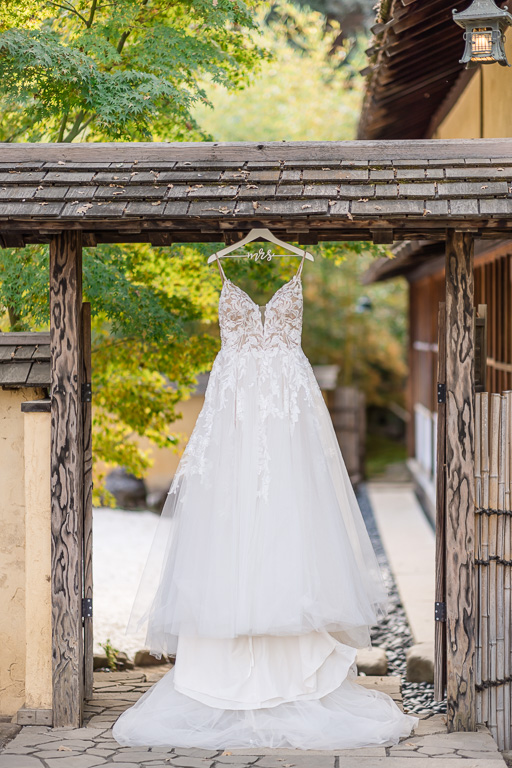 wedding dress photo hanging in the doorway at Hakone Gardens