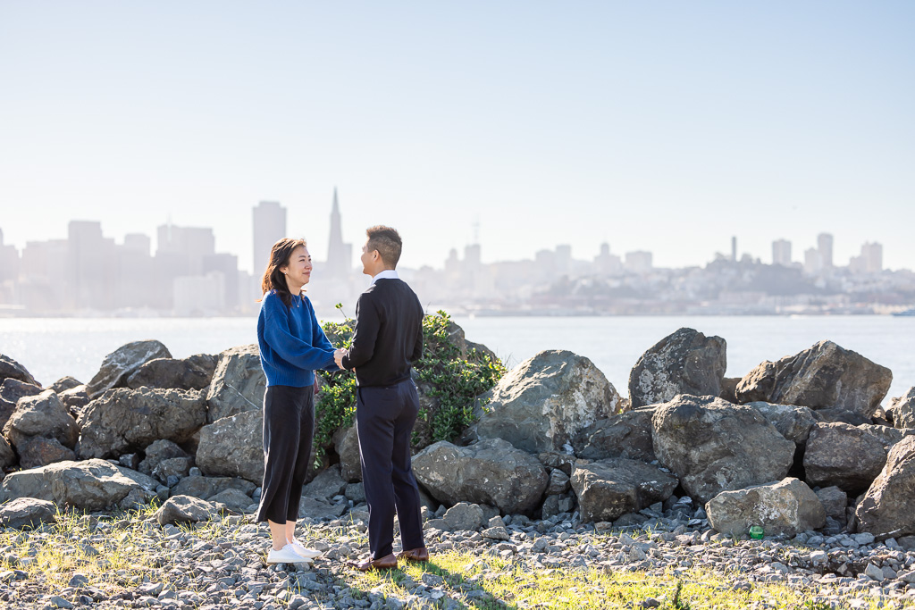 couple standing against the city backdrop