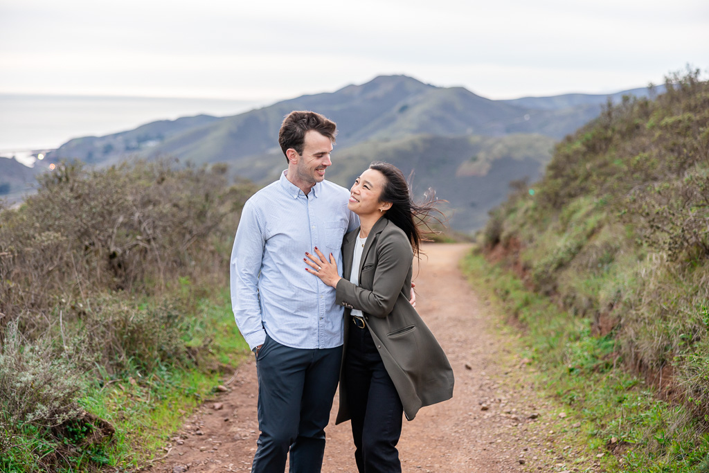 engagement photos on a hiking trail in the hills