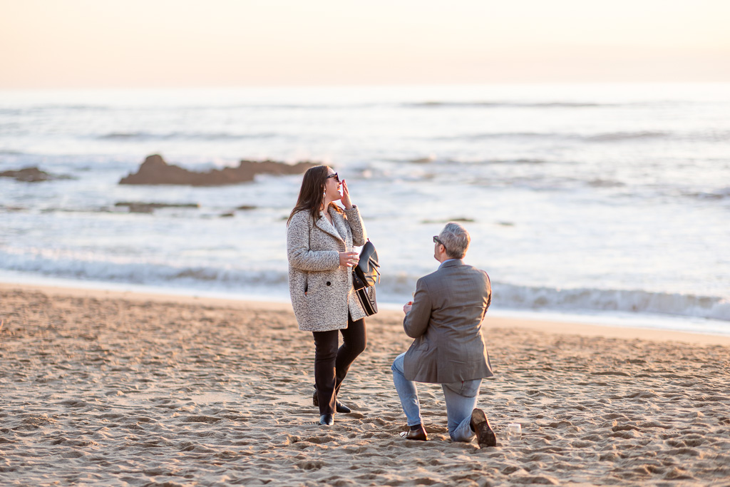 colorful sunset surprise proposal at Manhattan Beach in Half Moon Bay