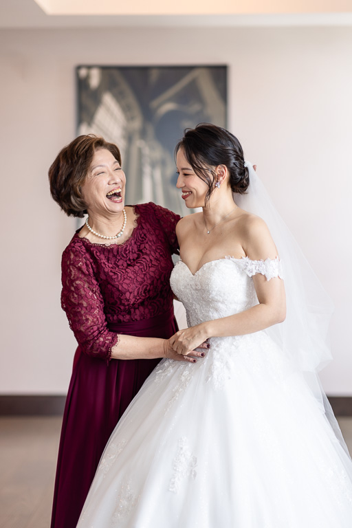 mom and bride sharing a sweet moment