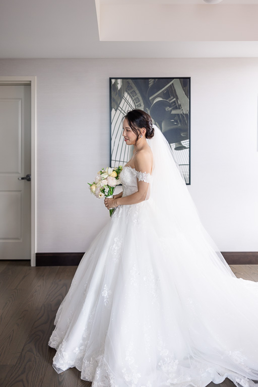 bride getting ready for first look with dad