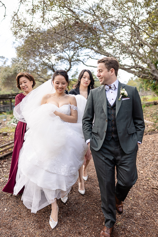 UC Botanic Garden candid photo of bride and groom