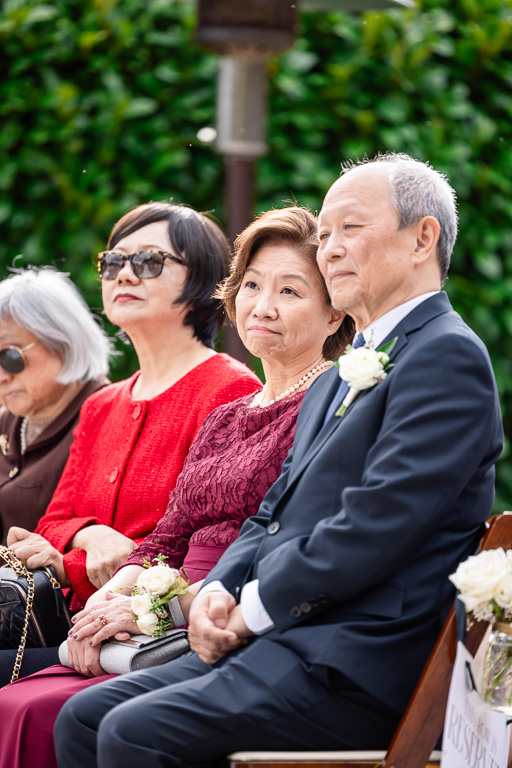 parents of the bride watching ceremony during wedding at The Brazilian Room