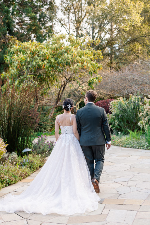 bride and groom walking near wedding venue in Tilden Park