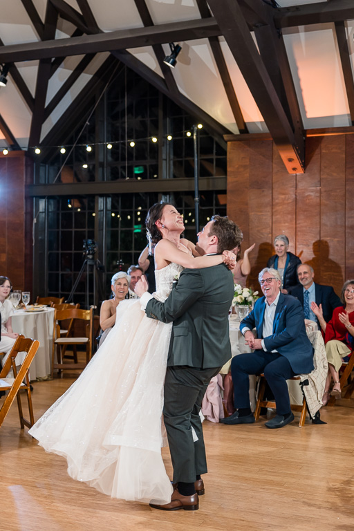 groom lifting the bride for first dance