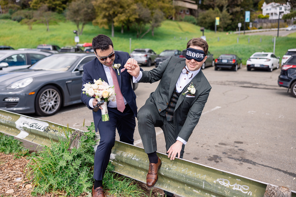 blindfolded groom being led to first look spot