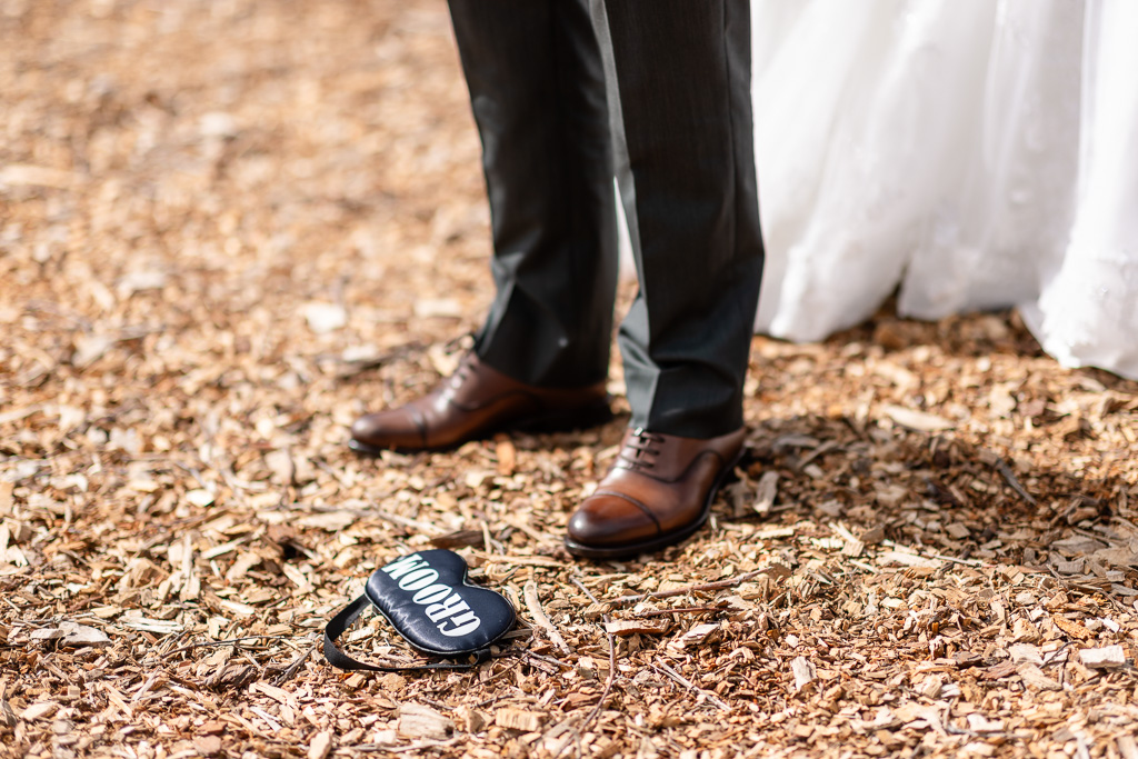 groom blindfold on the ground