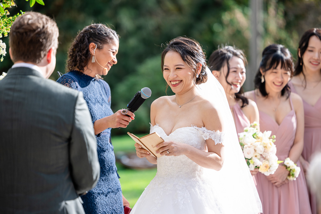 smiling bride reading her vows during Tilden Park wedding