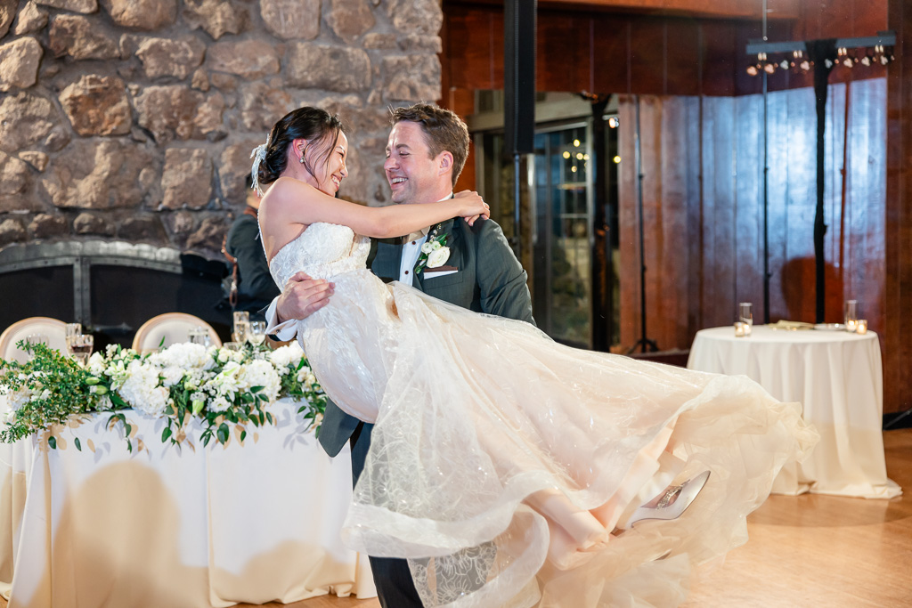 groom spinning the bride around for first dance