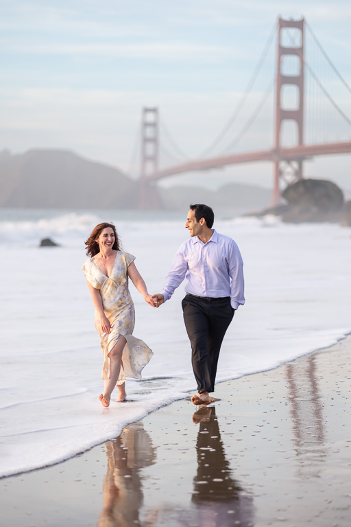 fun engagement shoot by the water near the Golden Gate Bridge at sunset