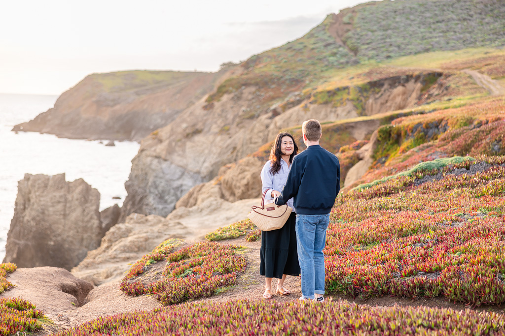 a couple standing on the vegetation at Rodeo Beach