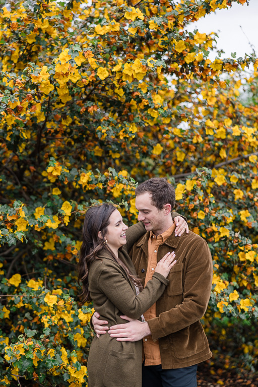 fall colored flowers engagement photos