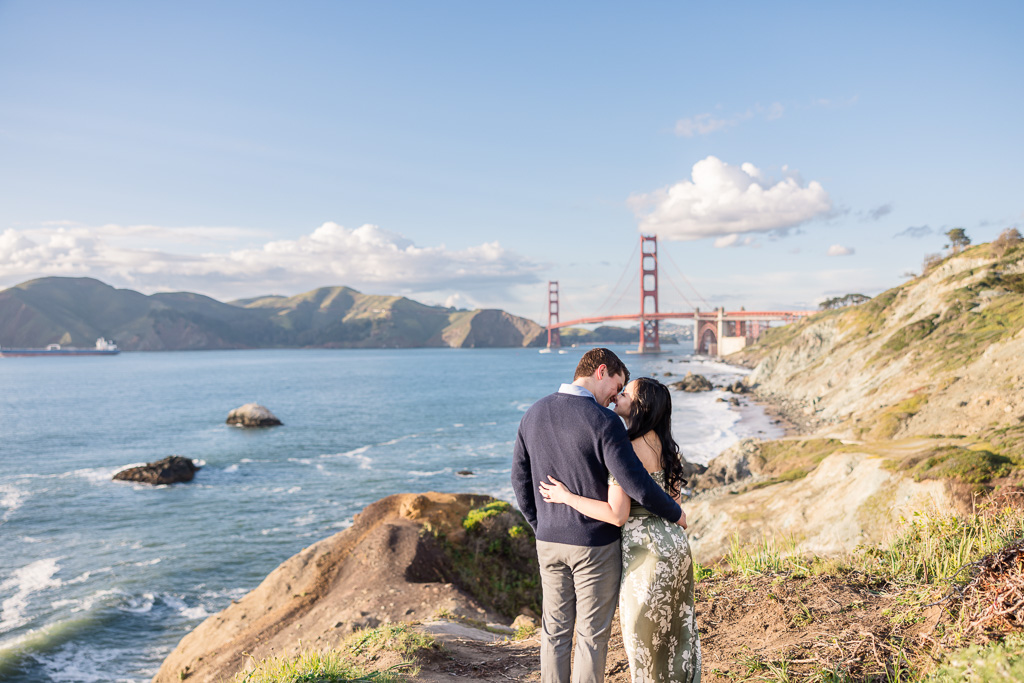 engagement photos looking away at the Golden Gate Bridge
