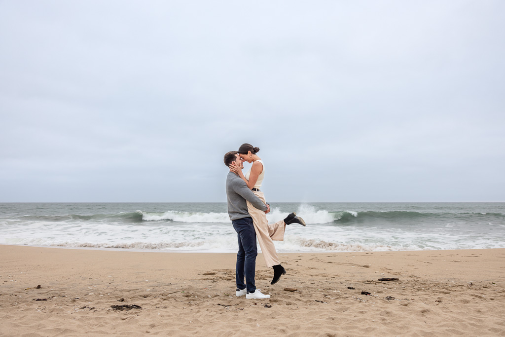 being lifted up for an engagement shot
