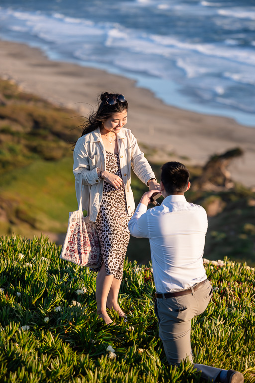 marriage proposal on a high cliff over the ocean