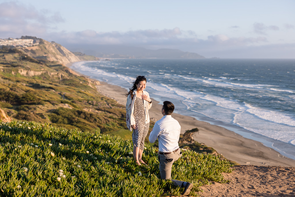 surprise proposal atop ocean bluff