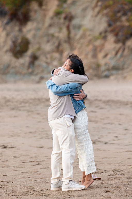 couple hugging on the beach