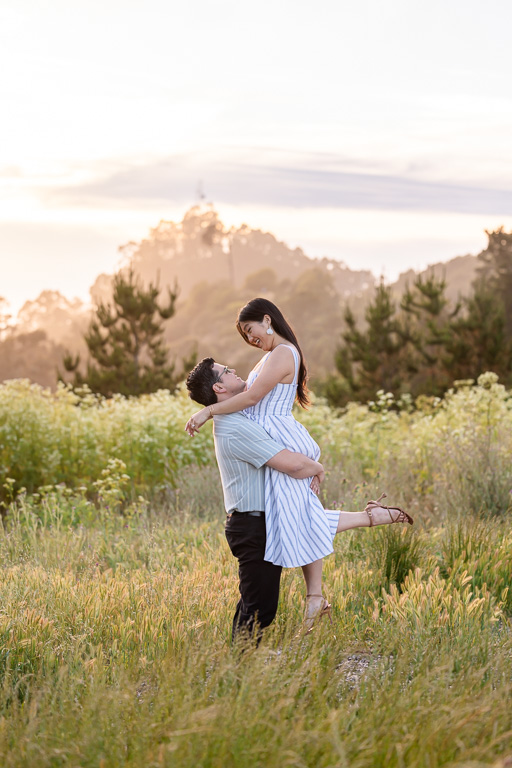 engagement shoot in a mountain grassy field