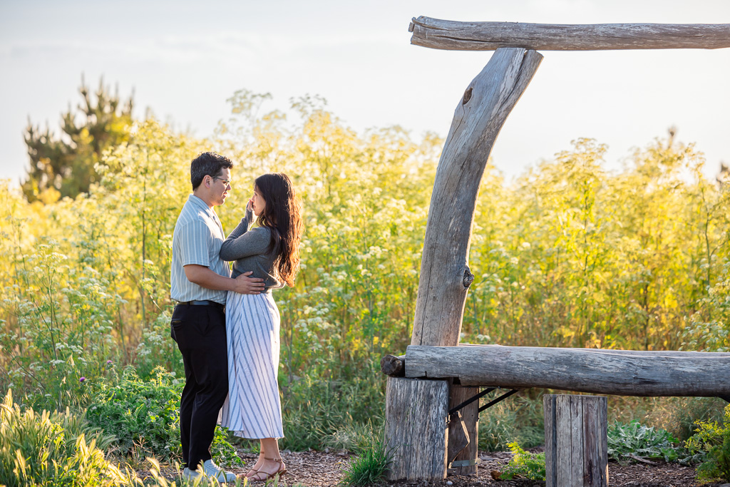 couple in a grassy field at sunset