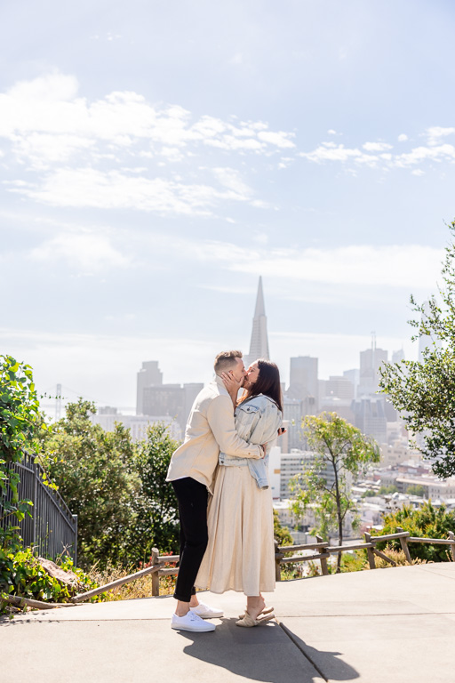 kissing after proposal at the park