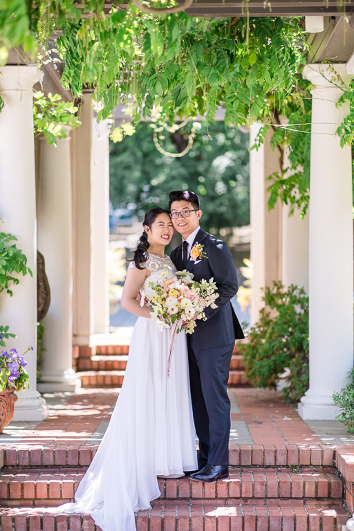 bride and groom under walkway