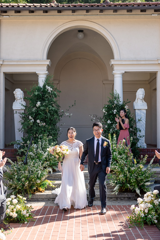 walking back up the aisle as husband and wife