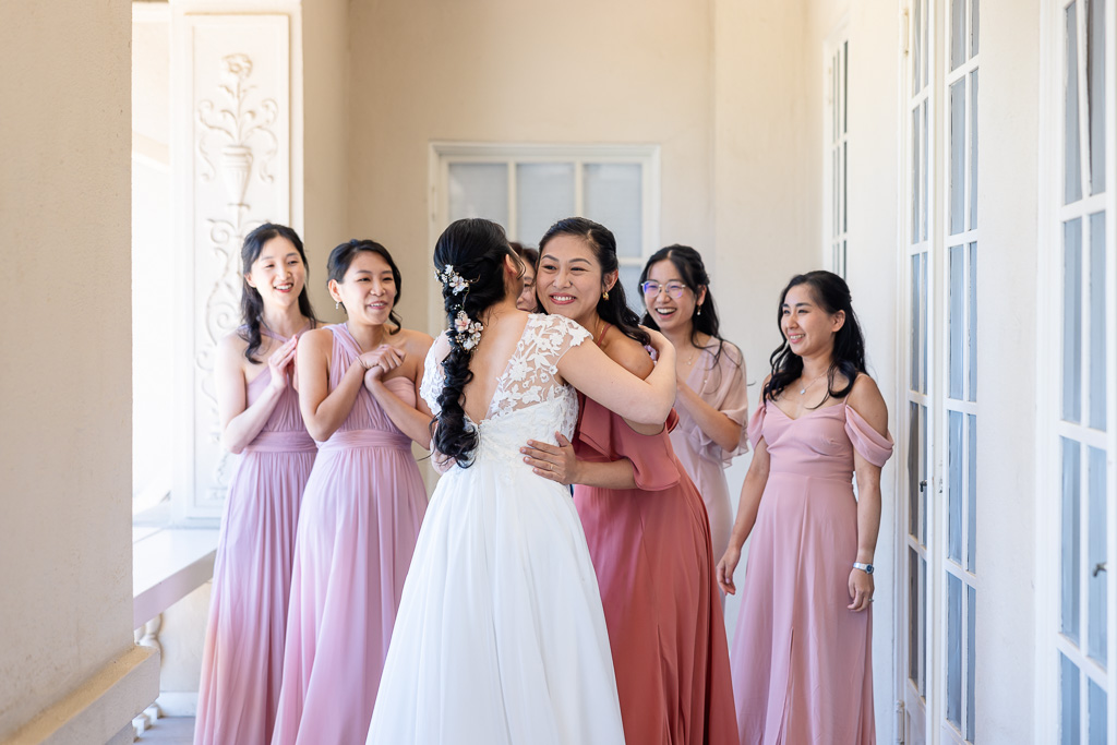 bride first look with bridesmaids