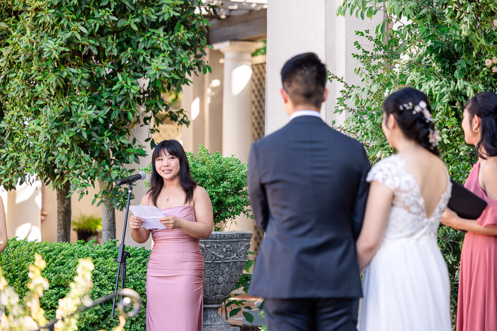 bridesmaid giving a reading during wedding ceremony at Montalvo