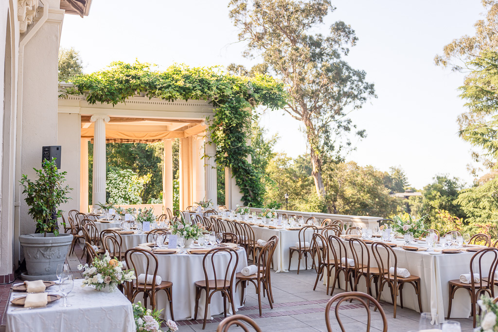 elegant reception tables and chairs set up on the patio of Villa Montalvo