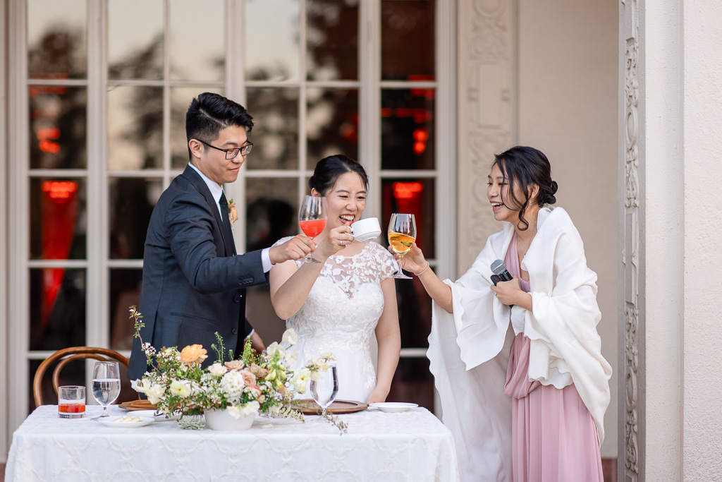 bridesmaids toasting the bride and groom