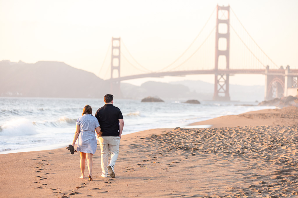 couple walking towards the Golden Gate Bridge