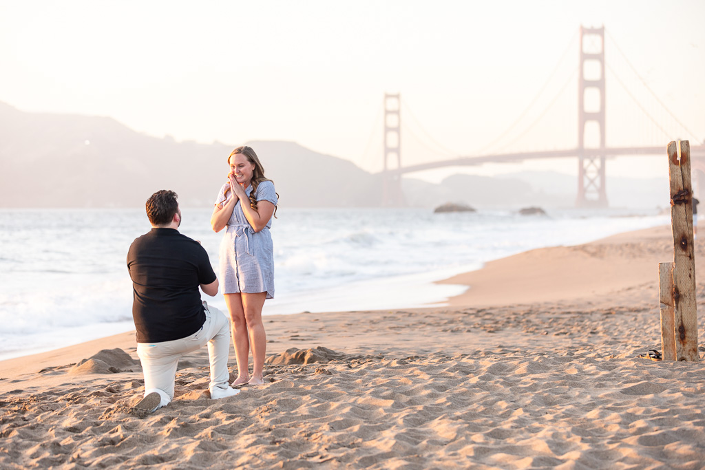 rainbow color sunset surprise proposal at Baker Beach