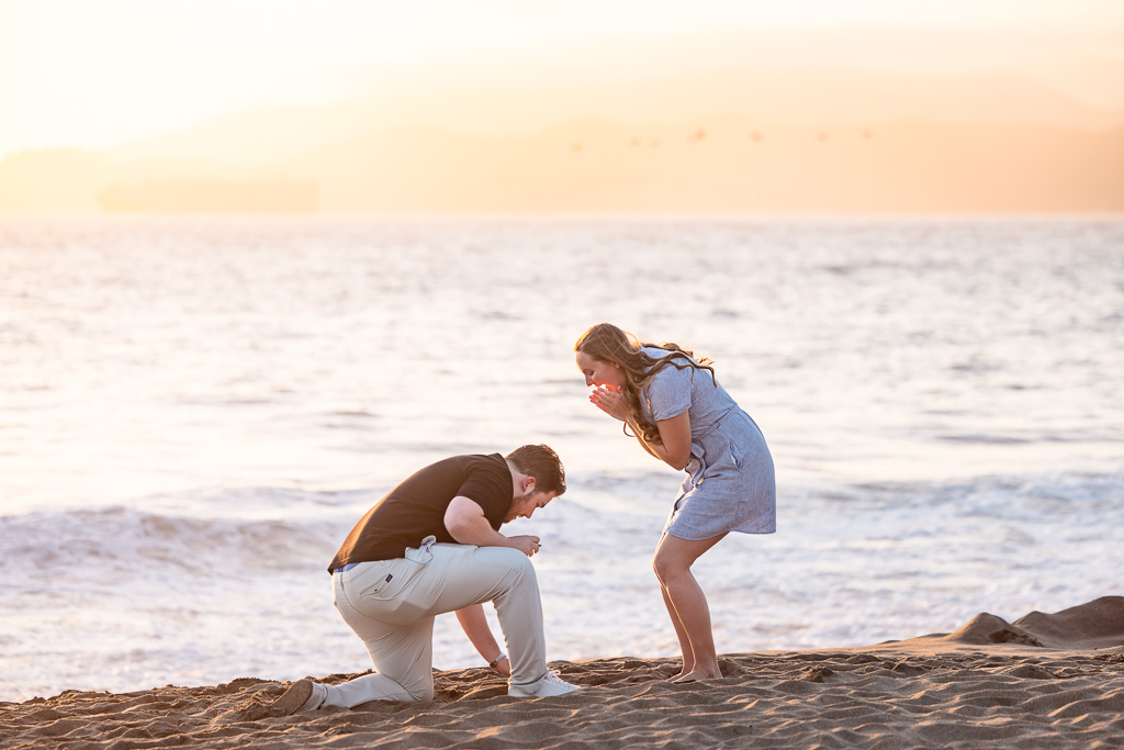 surprise proposal dropped the ring into sand