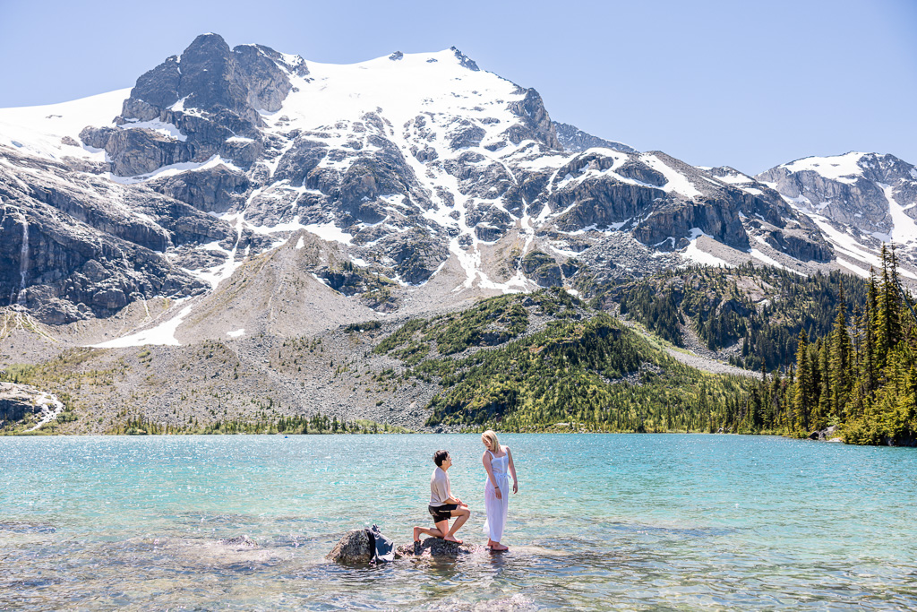 couple standing on a rock in Joffre Lakes