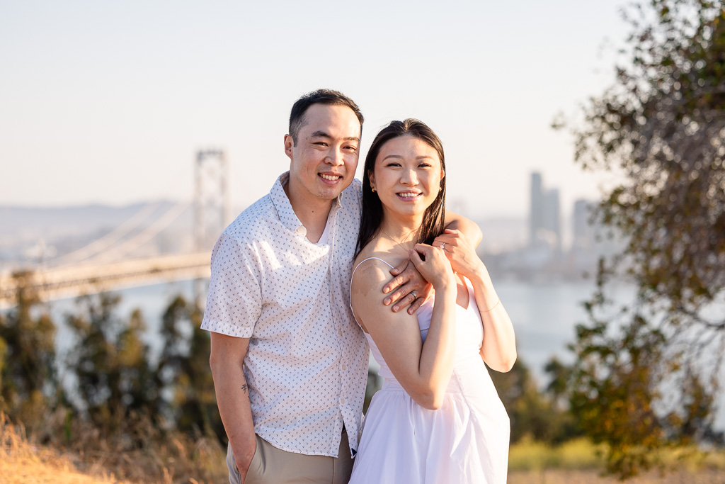 engagement photos with the Oakland Bay Bridge in the background