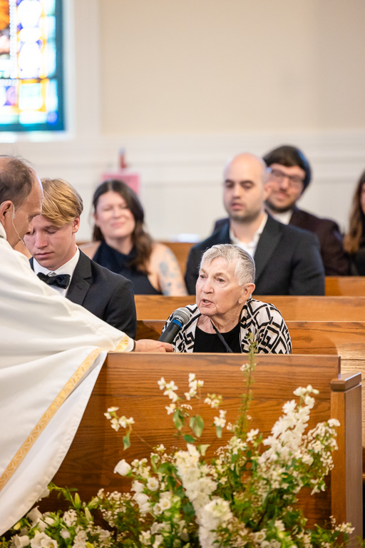 priest blessing grandma