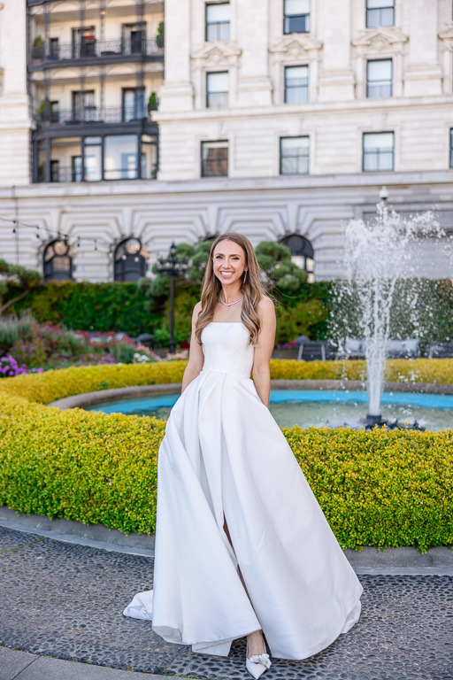 bride solo portrait at Fairmont SF fountain