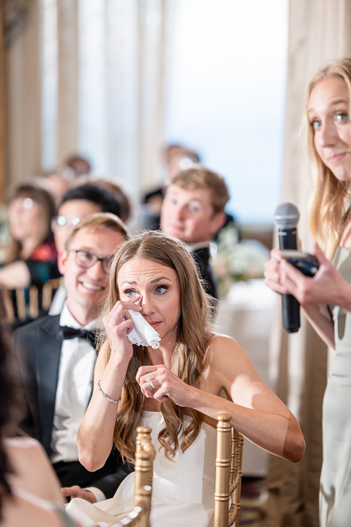 bride wiping away a tear during a touching speech