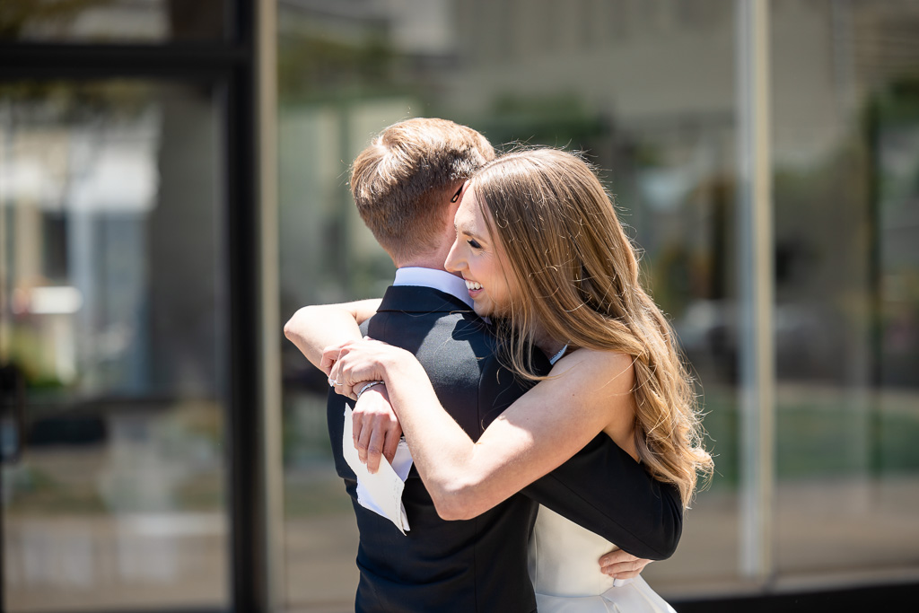 bride and groom hugging after private vows